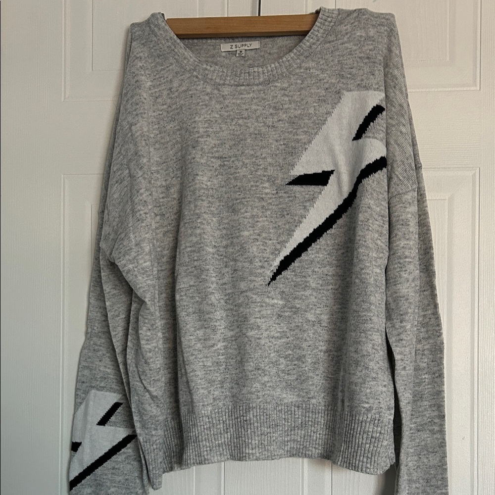 Zsupply Gray Sweater with Black bolt Accents
Size Medium.  Roomy